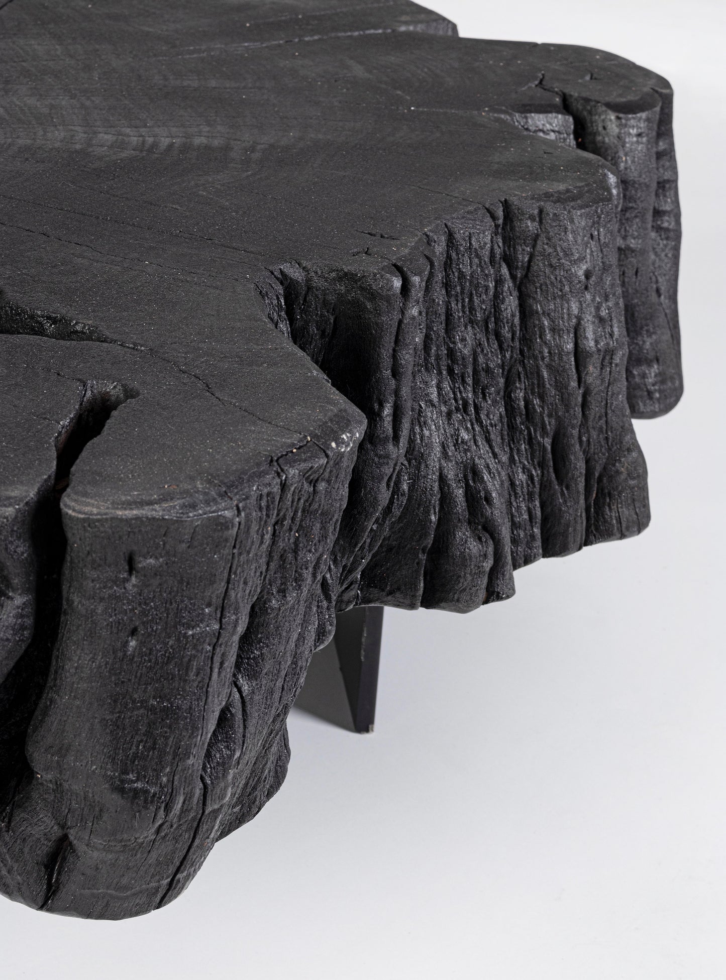 Tavolino da salotto in tronco massiccio nero gambe in acciaio